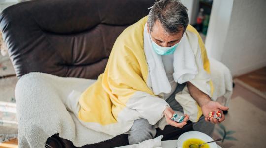 sick-man-in-mask-at-home